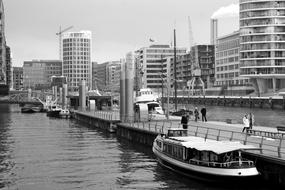 pier with ships near the city