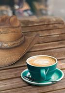 hot milk coffee in a green mug
