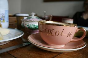 pink mug with gold signature