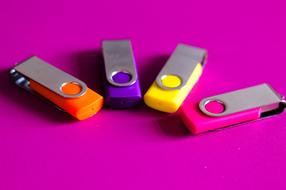 colored usb drive on phone