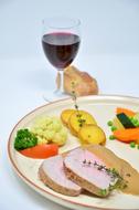 meat platter with vegetables and wine