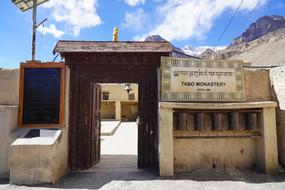 entrance made of wooden door and stones