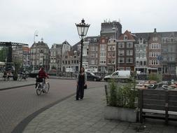 people walking through the square in Amsterdam