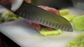 knife slicing cucumbers