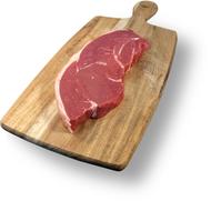 fresh piece of meat on a wooden board