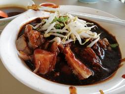 meat pieces with vegetables in sauce