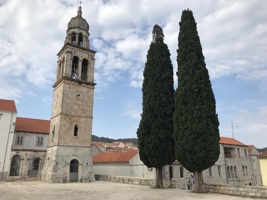 trees near the church landscape clouds