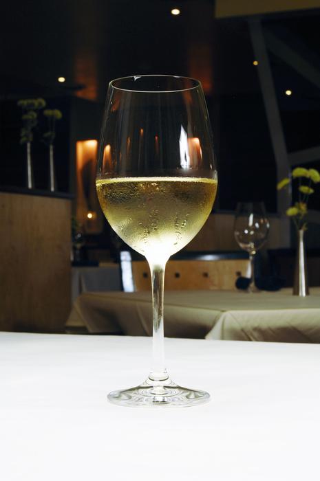 yellow alcoholic beverage in a glass