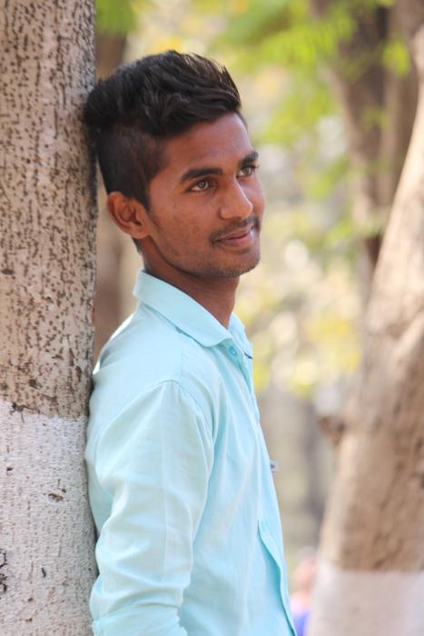 portrait of young adult dressed in blue shirt