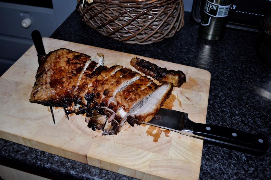 fried sliced meat on a wooden board