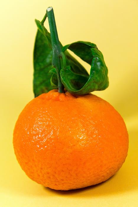 ripe tangerine with a leaf