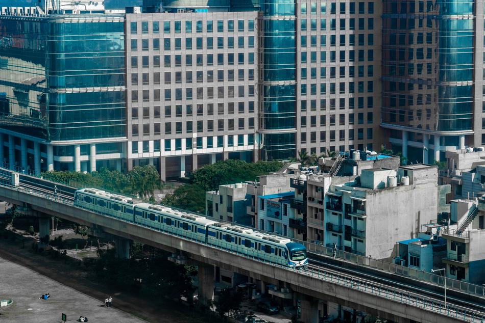 Cityscape of Buildings and Metro