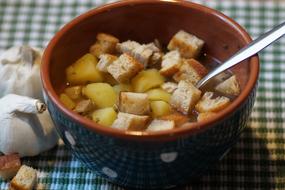 delicious soup with potatoes and croutons