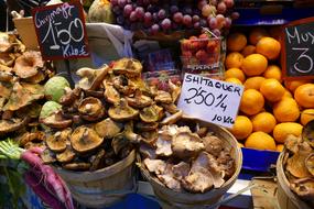 sale of delicious mushrooms and oranges