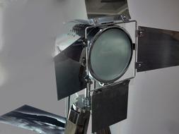 Close-up of the equipment, with the lamp, at grey background