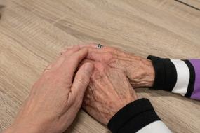 people's hands on the table