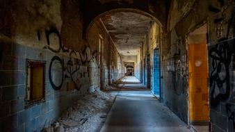 an old broken-down house with graffiti