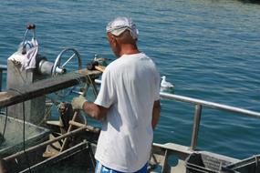 Old Fishing man on Sea in Italy