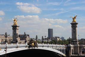 golden statues on the bridge