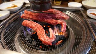 fried pieces of meat on the fire