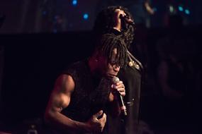 muscular male Singer on Concert