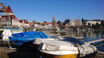 covered boats on the pier