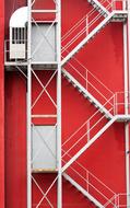 red house with white stairs