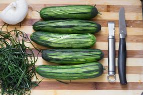 green delicious cucumbers on a wooden board