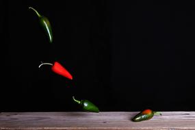 hovering peppers over the table