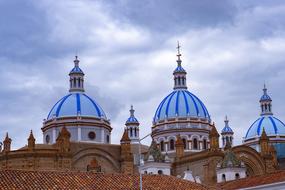 the building with the blue roof and the red house