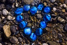 blue rocks on the beach with the sea