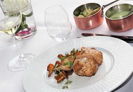 roast meat garnished with basil