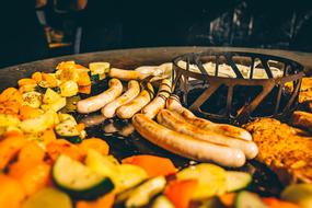 delicious table with vegetables and sausages