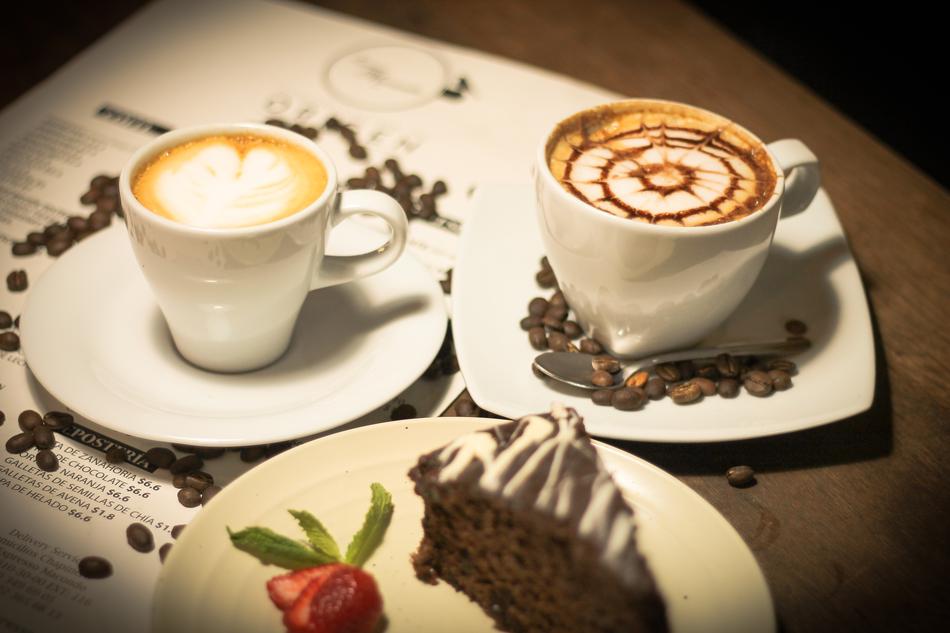 two hot cappuccinos with a pattern