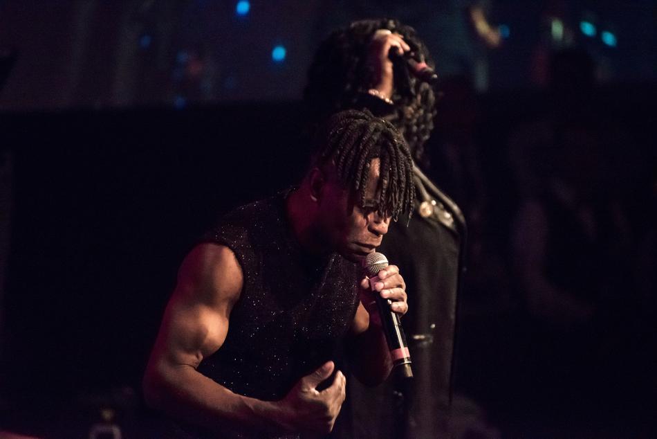 muscular male Singer on Concert