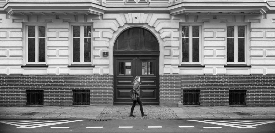 a man walks by the palace