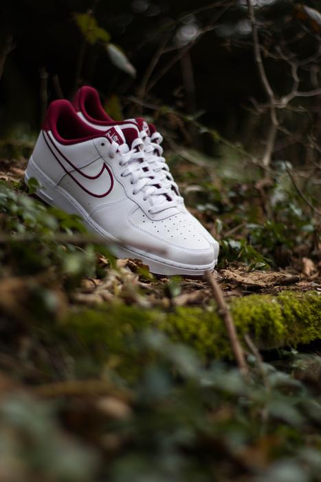 white sneakers on green grass