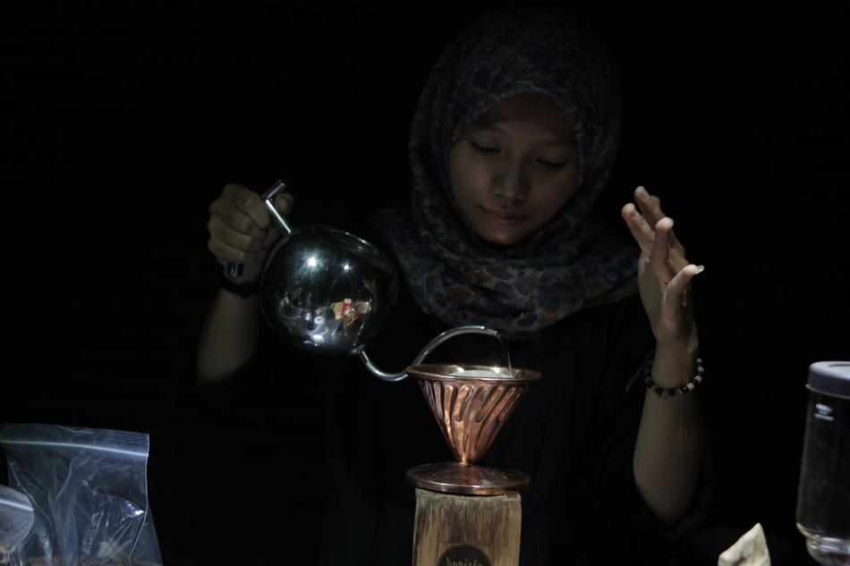 beautiful girl makes coffee