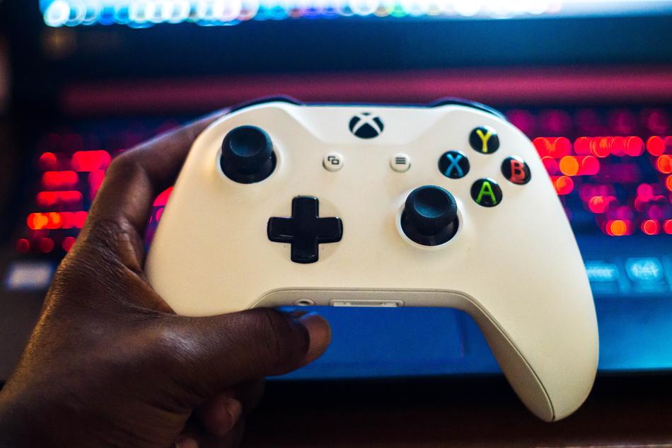 white game joystick in hand
