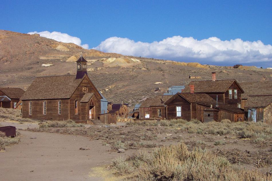 wooden houses in the countryside in the field