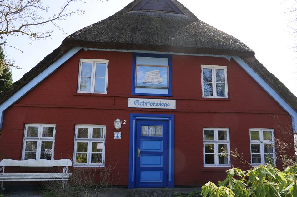 red house with white windows