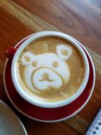 delicious coffee with a bear pattern