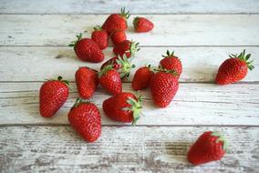 scattered strawberries on the table