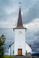 white tower on the background of clouds