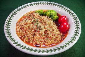 Noodles in tomato sauce with vegetables