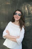 a girl in a white blouse and glasses