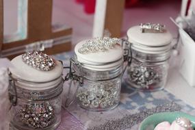Close-up of the glass jars with accessories