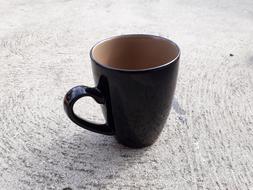 brown mug on a white table
