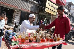 a man sells oils on the street