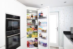 Open fridge full of food